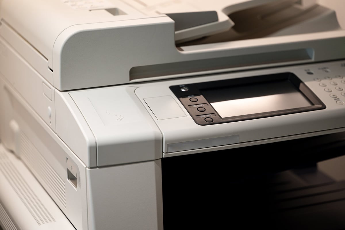 Close-up of a Multifunction Office Printer with Control Panel and Document Feeder